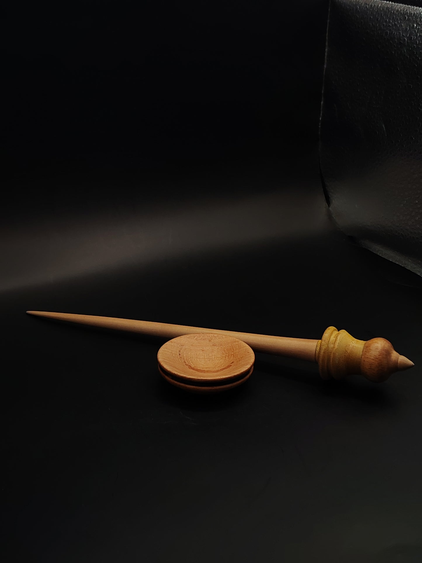Elegant handmade support spindle designed with natural apple shaft and dual-tone whorl