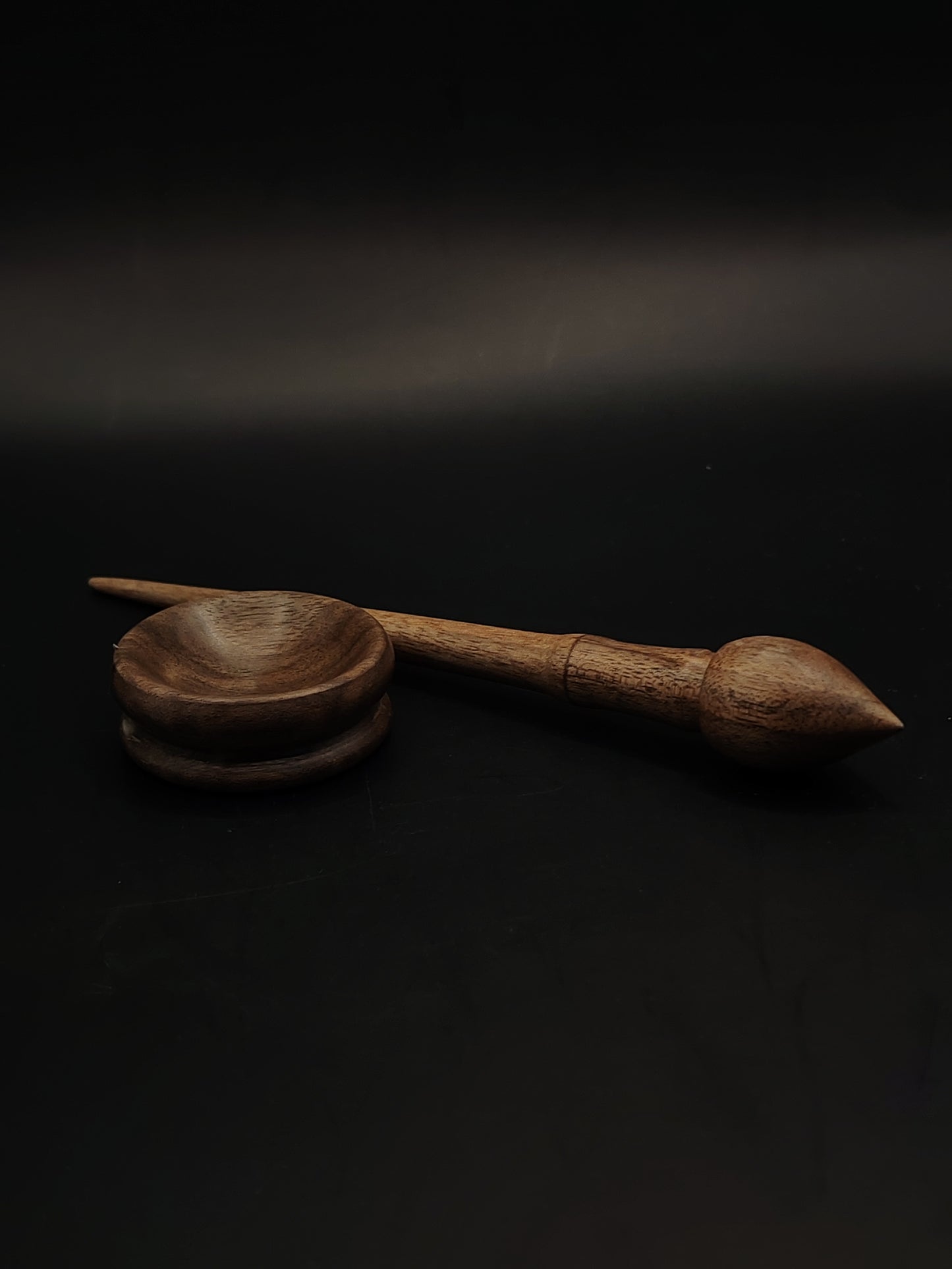 An ultra-light 7 g walnut mini support spindle with a matching tiny spinning bowl — perfect for cotton, fine yarns, travel spinning, or collectors.