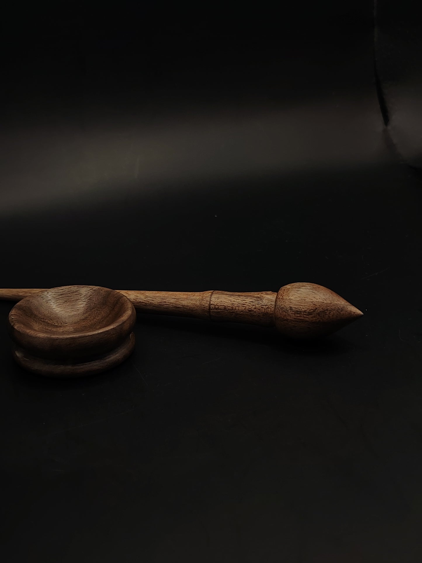 An ultra-light 7 g walnut mini support spindle with a matching tiny spinning bowl — perfect for cotton, fine yarns, travel spinning, or collectors.