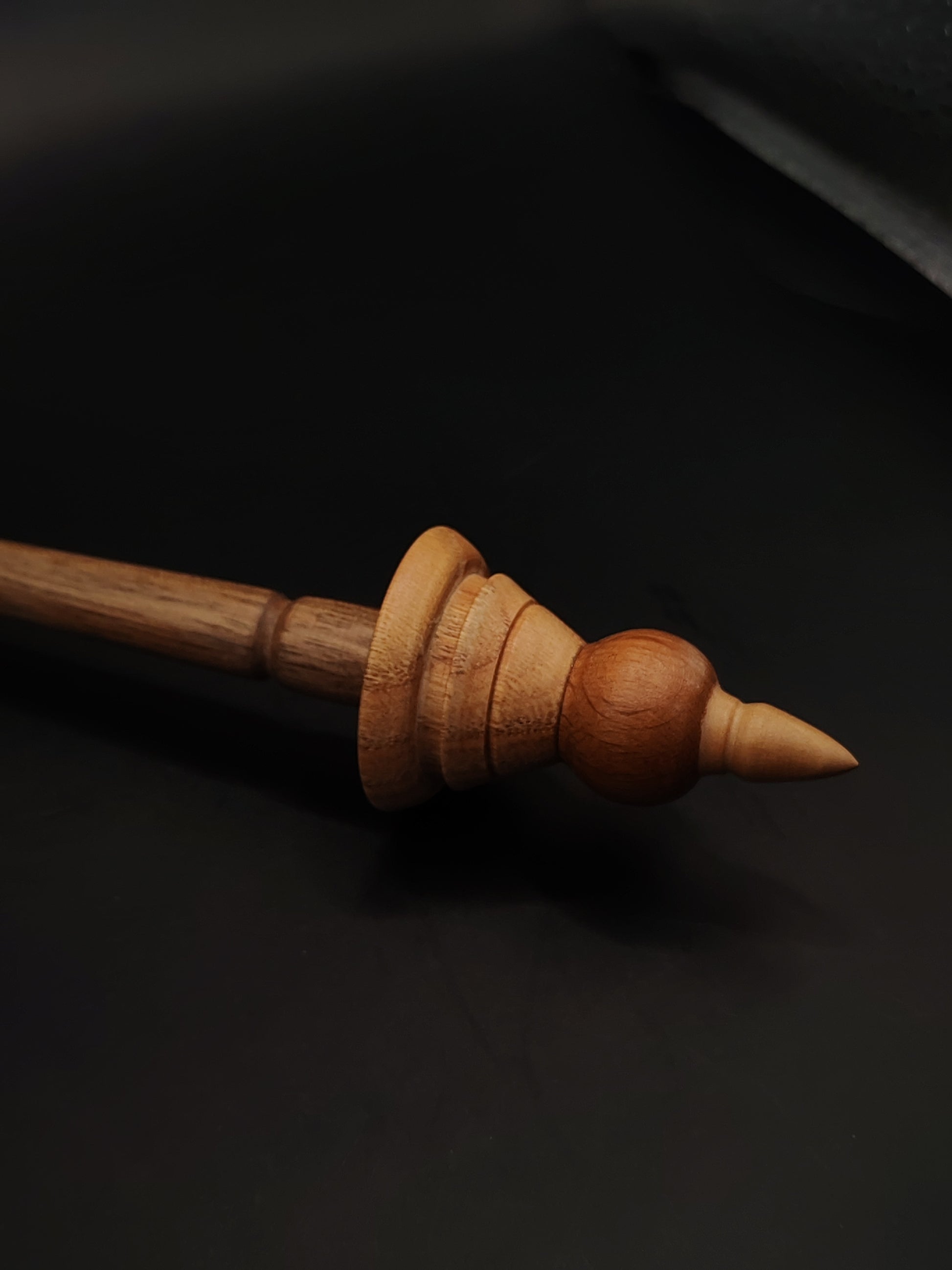 Close-up of 26.5 cm support spindle showing detailed chestnut and beech wood whorl