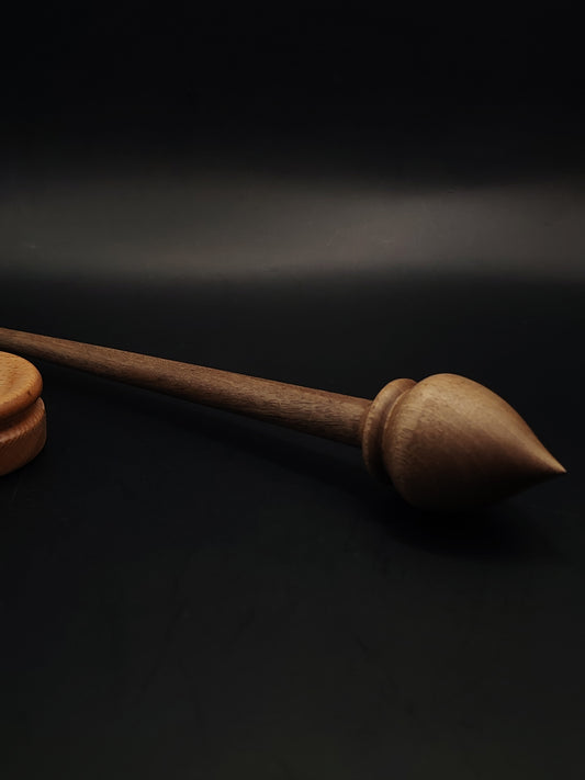 Handcrafted walnut support spindle paired with smooth beech spinning bowl