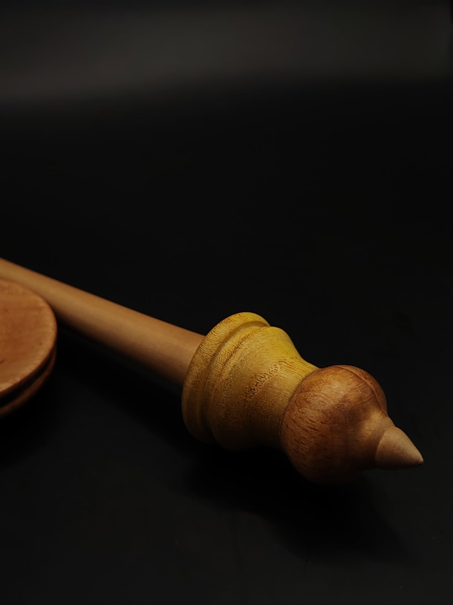 Handmade support spindle featuring light apple shaft and contrasting whorl design