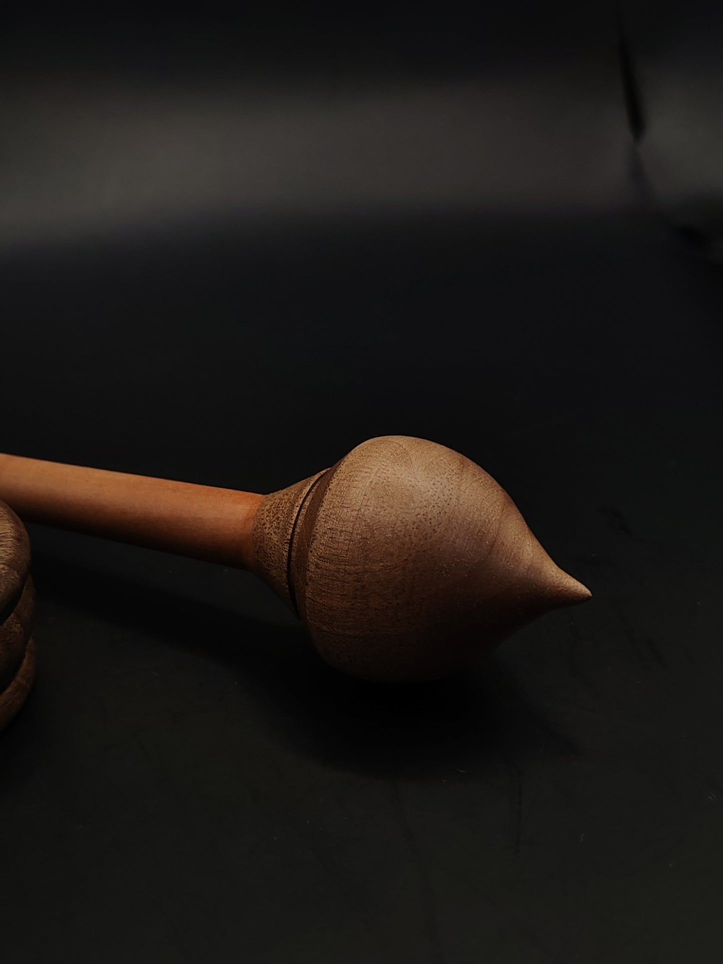 Close-up of 26 cm support spindle with balanced walnut whorl and matching spinning bowl